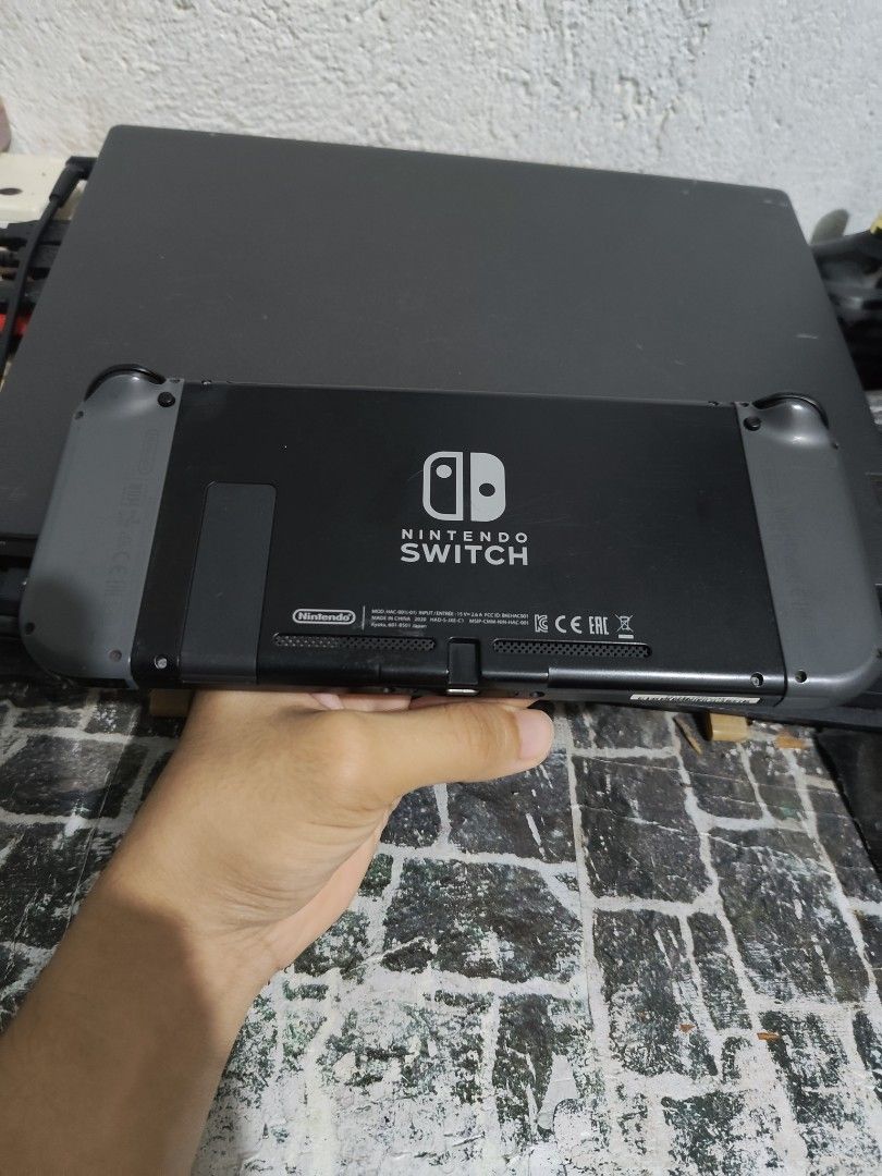Nintendo Switch Console V1 (Category: Nintendo) located in Calamba. Submitted by teryroger23 (Listing ID 1431592862, Image 2). Description: - Nintendo Switch console included - Comes with a pair of Joy-Con controllers (STILL IN GOOD CONDITION) - Includes original charger - Console color: Black and gray - Includes 32GB SD CARD - With hard case pouch (can provide photos if asked) - No dock and hdmi cable.