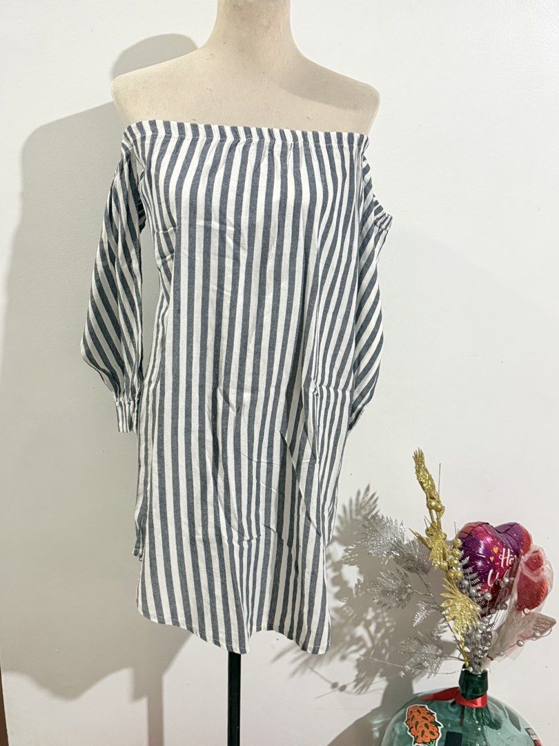 Off-Shoulder Striped Dress (Category: Dresses) located in Caloocan City. Submitted by dddddddddddeclutter (Listing ID 1431742660, Image 1). Description: - Off-shoulder dress - Gray and white striped pattern - Long sleeves - Relaxed fit - Lightweight fabric - Ideal for casual wear - Versatile style.