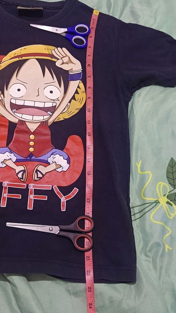 One Piece Luffy T-shirt (Category: Babies & Kids Fashion) located in Manila. Submitted by weekend-thrift (Listing ID 1431683659, Image 3). Description: - Navy blue Luffy t-shirt - Brand: Baleno Junior - Features a large Luffy graphic - Size: Approximately 23 inches long, 16 inches across the chest - Style: Short sleeves, crew neck #carousave2026.