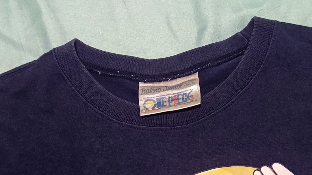 One Piece Luffy T-shirt (Category: Babies & Kids Fashion) located in Manila. Submitted by weekend-thrift (Listing ID 1431683659, Image 2). Description: - Navy blue Luffy t-shirt - Brand: Baleno Junior - Features a large Luffy graphic - Size: Approximately 23 inches long, 16 inches across the chest - Style: Short sleeves, crew neck #carousave2026.