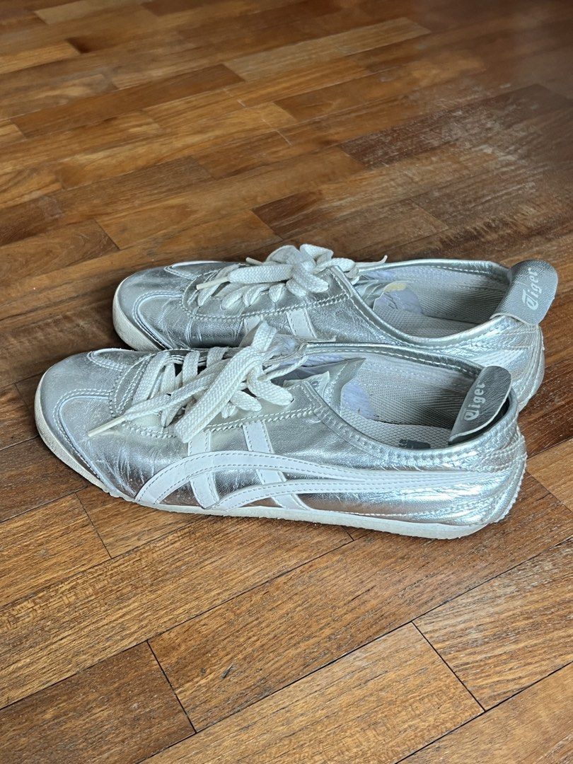 ONITSUKA TIGER Mexico 66 Silver Sneakers (Category: Sneakers) located in Singapore. Submitted by nxtxlie_ (Listing ID 1431653792, Image 1). Description: Size EU 37.5/ US 5/ 23.5CM RTP: $190 Well worn, condition is as shown in the pictures. Dm me for more pictures of the condition of the shoes :) .