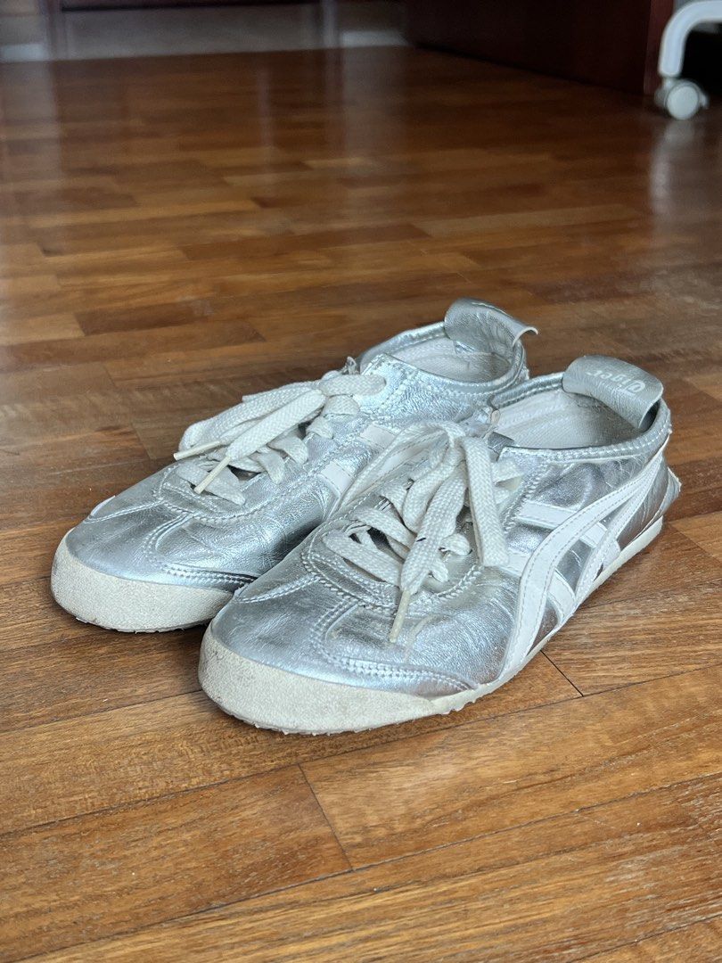 ONITSUKA TIGER Mexico 66 Silver Sneakers (Category: Sneakers) located in Singapore. Submitted by nxtxlie_ (Listing ID 1431653792, Image 2). Description: Size EU 37.5/ US 5/ 23.5CM RTP: $190 Well worn, condition is as shown in the pictures. Dm me for more pictures of the condition of the shoes :) .