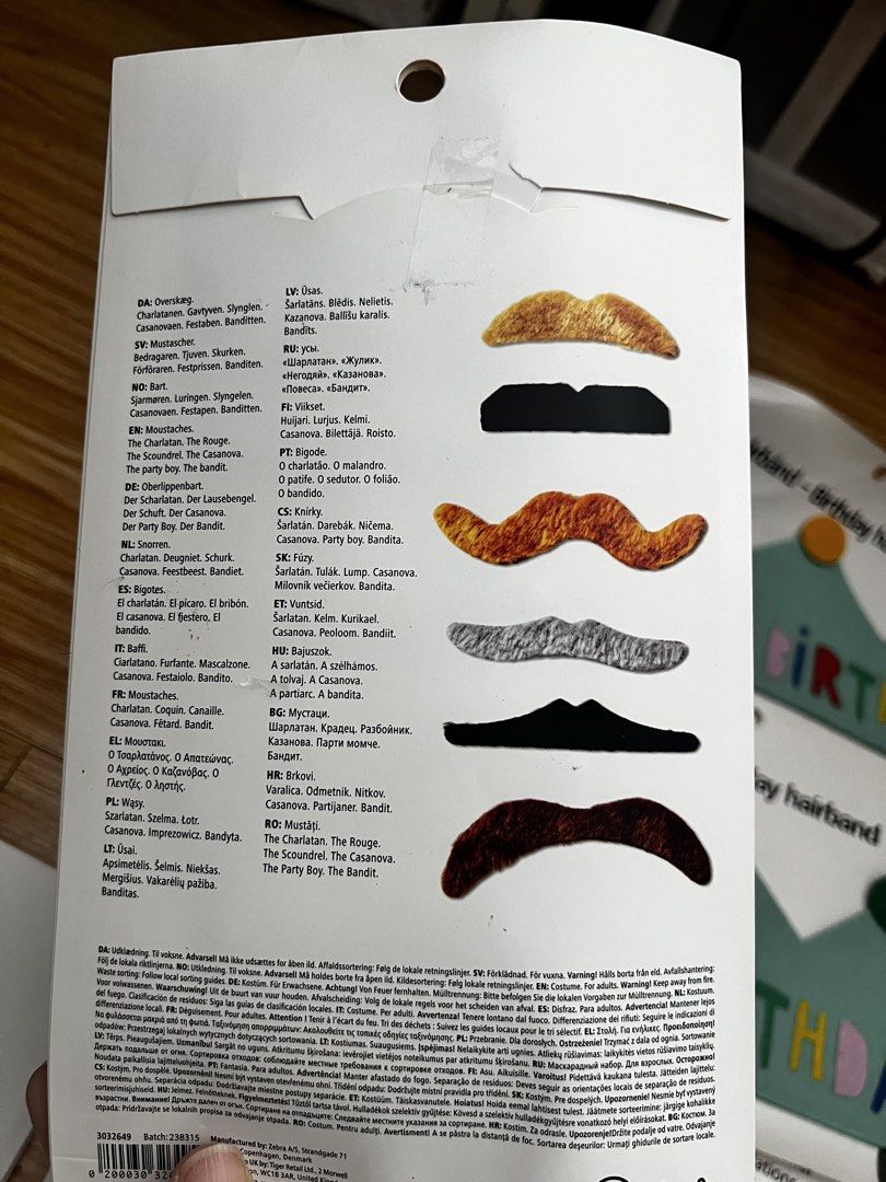 Overskæg Moustaches - 6 pcs (Category: Vintage Collectibles) located in Taguig. Submitted by fifileen (Listing ID 1431612222, Image 2). Description: - Six unique moustache designs included. - Features a woman with various moustaches on the packaging. - Back of packaging displays each style. - Ideal for parties and costume events..