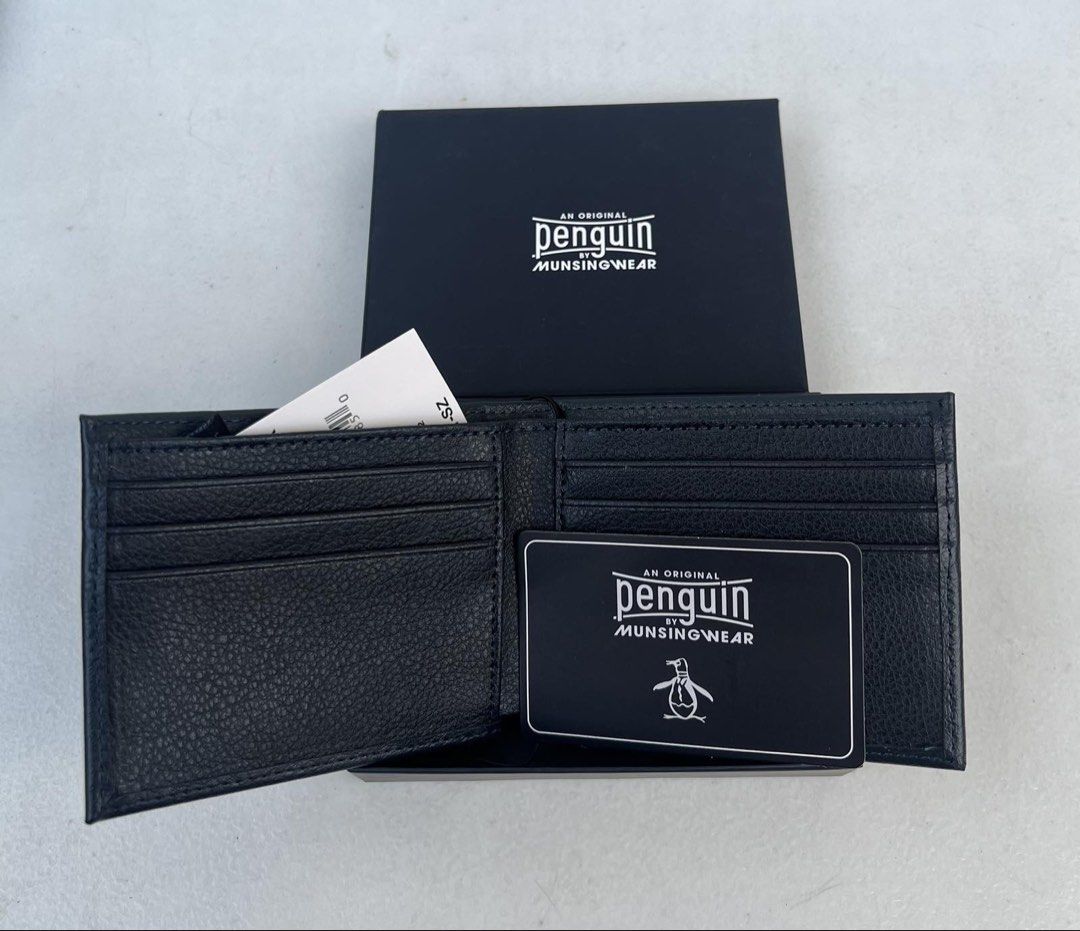 Penguin Munsingwear Leather Wallet (Category: Wallets & Card Holders) located in Quezon City. Submitted by soohthings (Listing ID 1431577228, Image 2). Description: - Penguin Munsingwear wallet - Made of genuine black leather - Features multiple card slots and a bill compartment - Comes with original box and tags - Original ; bought directly in Penguin store in US.