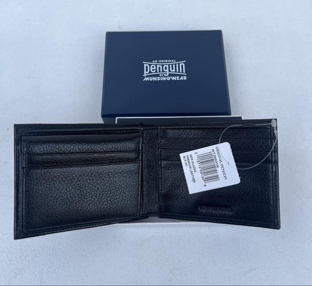 Penguin Munsingwear Leather Wallet (Category: Wallets & Card Holders) located in Quezon City. Submitted by soohthings (Listing ID 1431577371, Image 3). Description: - Penguin munsingwear wallet - Made of black leather - Includes a passcase with a removable ID wallet - Multiple card slots - Compartments for bills - Comes with original box & tags - Original ; directly bought in Penguin store in US.