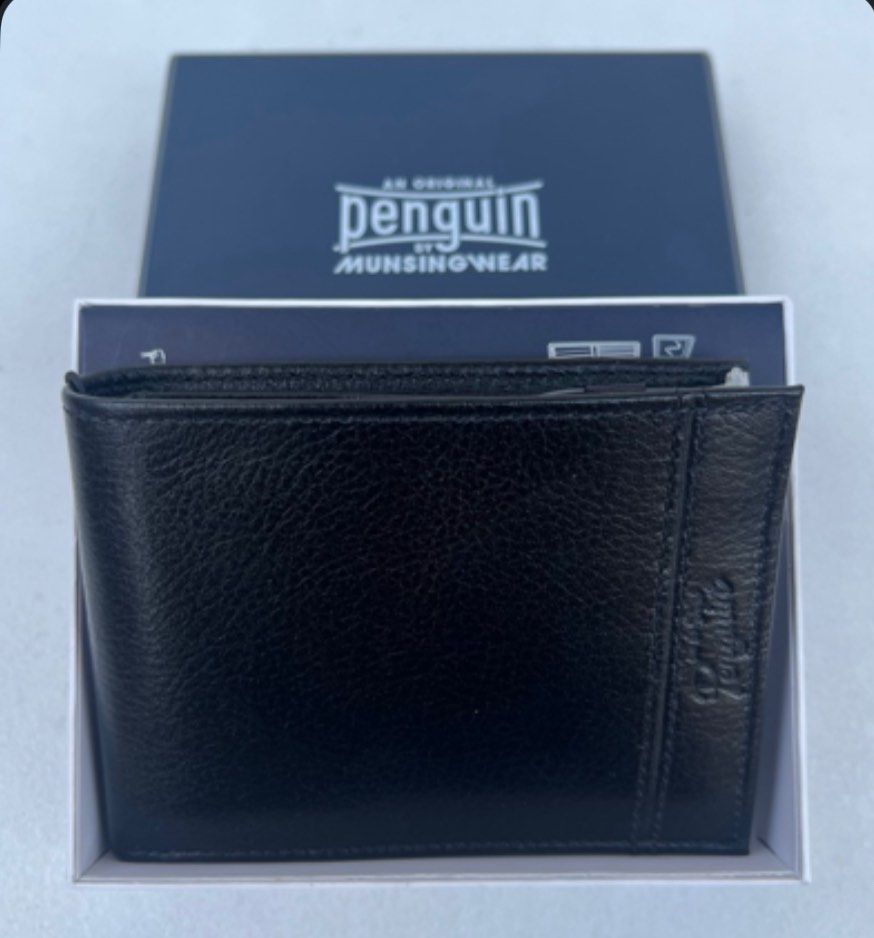 Penguin Munsingwear Leather Wallet (Category: Wallets & Card Holders) located in Quezon City. Submitted by soohthings (Listing ID 1431577371, Image 1). Description: - Penguin munsingwear wallet - Made of black leather - Includes a passcase with a removable ID wallet - Multiple card slots - Compartments for bills - Comes with original box & tags - Original ; directly bought in Penguin store in US.