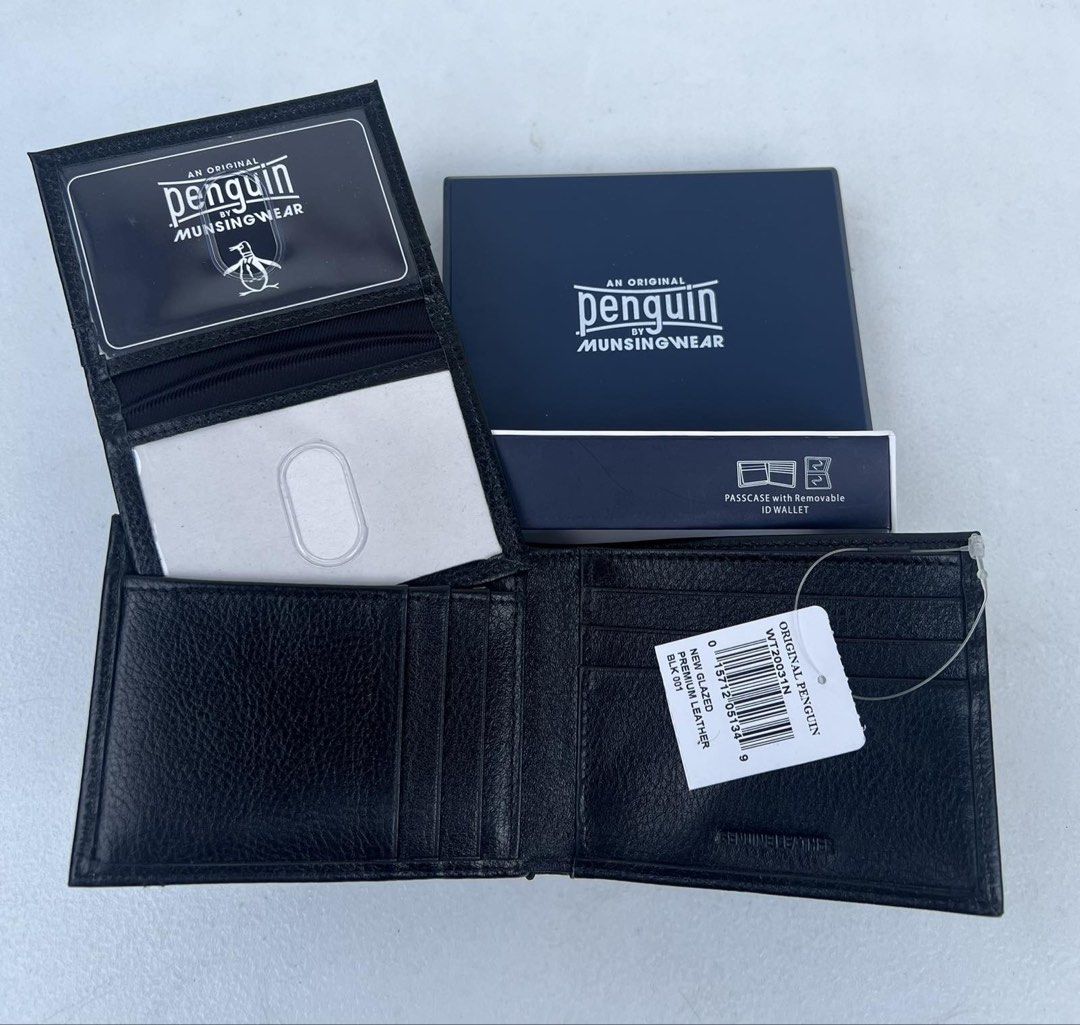 Penguin Munsingwear Leather Wallet (Category: Wallets & Card Holders) located in Quezon City. Submitted by soohthings (Listing ID 1431577371, Image 2). Description: - Penguin munsingwear wallet - Made of black leather - Includes a passcase with a removable ID wallet - Multiple card slots - Compartments for bills - Comes with original box & tags - Original ; directly bought in Penguin store in US.