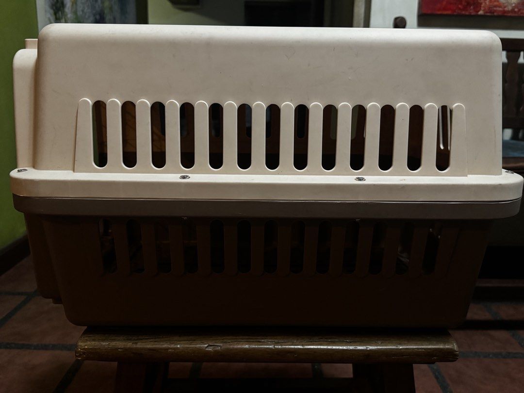 Pet Carrier - Brown and Beige (Category: Homes & Other Pet Accessories) located in Quezon City. Submitted by limebasil (Listing ID 1431730587, Image 1). Description: - Durable pet carrier in brown and beige - Secure metal door - Ventilation slots for airflow - Top handle for easy carrying - Suitable for small to medium-sized pets - Sturdy base and secure locking mechanism - Perfect for travel or vet visits Measurements: Height: 13 inches Side: 22