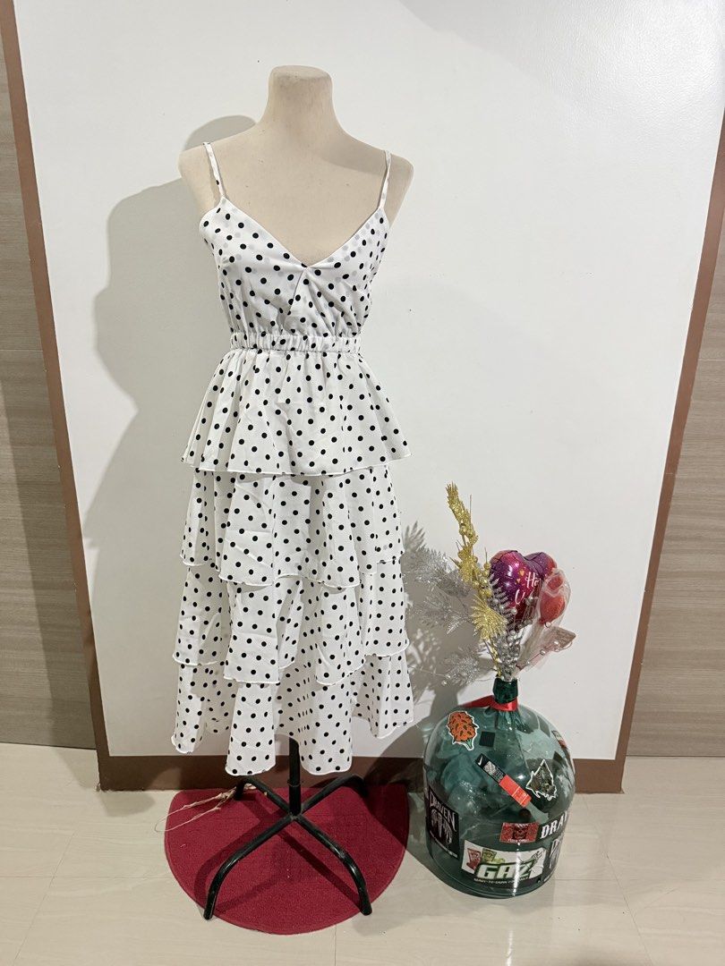 Polka Dot Tiered Dress (Category: Dresses) located in Caloocan City. Submitted by dddddddddddeclutter (Listing ID 1431742897, Image 1). Description: - White dress with black polka dots - Features a V-neckline and spaghetti straps - Fitted waist - Tiered skirt - Made of lightweight fabric - Perfect for warm weather.