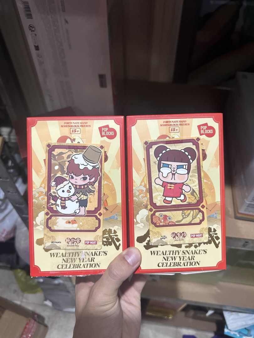 Pop Mart Wealthy Snake's New Year Celebration (Category: Designer & Blind Box Toys) located in Manila. Submitted by lebronlabubu (Listing ID 1431696483, Image 1). Description: - Pop Mart Wealthy Snake New Year Celebration blind box figures. - Each box contains a mystery figure. - Features festive Chinese New Year designs. - Suitable for ages 15 and up. - Part of the Pop Blocks series..