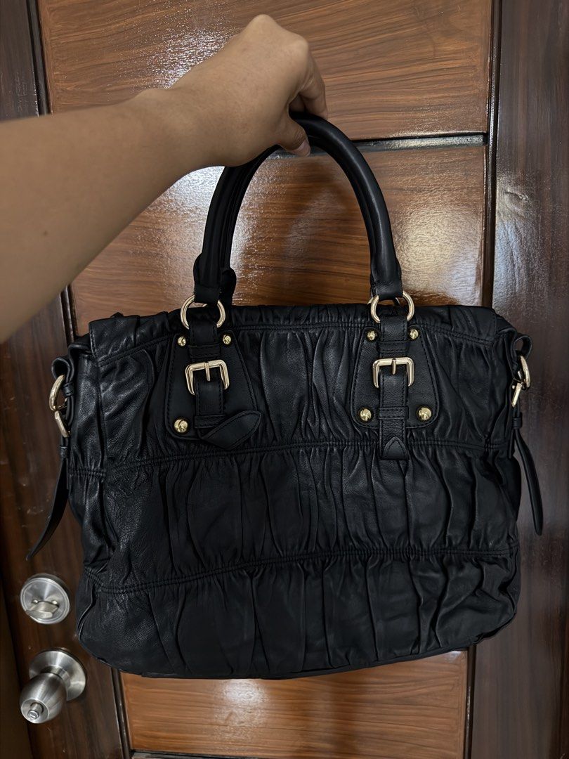 Prada Jacquard (Category: Luxury Bags & Wallets) located in Quezon City. Submitted by egptasiaco (Listing ID 1431682231, Image 2). Description: Selling my bag With authenticity card Money back guaranteed if proven fake All gold hard wares and good condition.