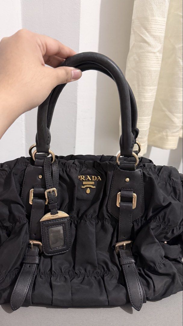 Prada Tessuto Nylon Gaufre (Category: Luxury Bags & Wallets) located in Quezon City. Submitted by maycee_vintage (Listing ID 1431737424, Image 1). Description: Prada Tessuto Nylon Gaufre Authentic Excellent Condition Leather strap not available but you can always buy one. Hardawares are still gold .