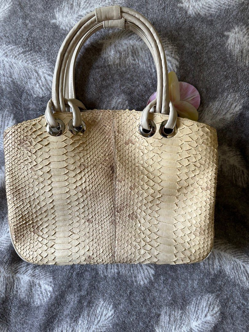 Python Skin Handbag (Category: Shoulder Bags) located in Pasig City. Submitted by passingpieces (Listing ID 1431669659, Image 2). Description: - Beige python skin handbag - Magnetic closure - issue sa bottom (check photo) accessory not included.