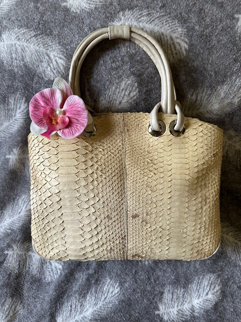 Python Skin Handbag (Category: Shoulder Bags) located in Pasig City. Submitted by passingpieces (Listing ID 1431669659, Image 1). Description: - Beige python skin handbag - Magnetic closure - issue sa bottom (check photo) accessory not included.