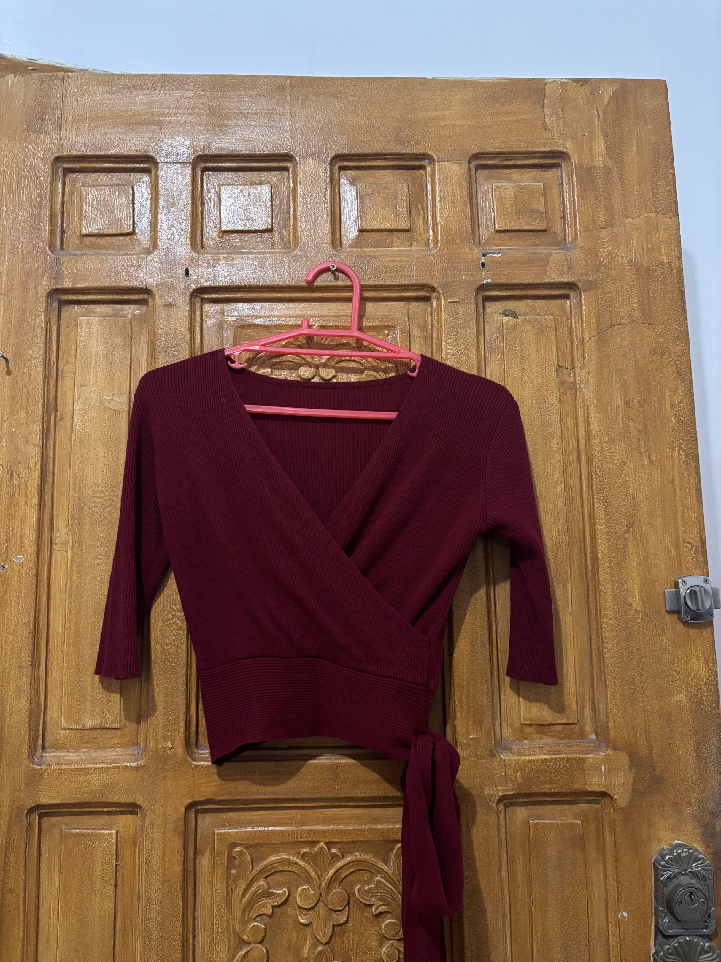 Ribbed Maroon V-Neck Surplice Wrap Top with Side Tie (Category: Blouses) located in Cavite. Submitted by clawsetangelaco (Listing ID 1431654286, Image 1). Description: Brand: Unbranded / Generic Fabric: Ribbed Knit (Polyester Blend) Color: Maroon / Burgundy Size: Small to Medium (Freesize) MOP: Gcash only (Free SF) Weekend Shipment only.