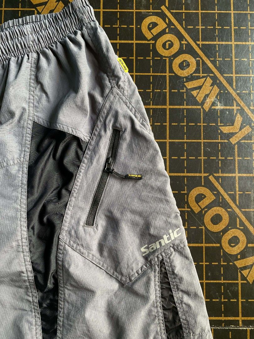 Santic Cycling Shorts - XL (Category: Activewear) located in Manila. Submitted by raymondrob54698 (Listing ID 1431737344, Image 2). Description: - Santic cycling shorts - Color: Gray with black accents - Size: XL - Features: - Zippered pockets - Elastic waistband with drawstring - Santic logo on leg - Ideal for cycling and outdoor activities with pad.