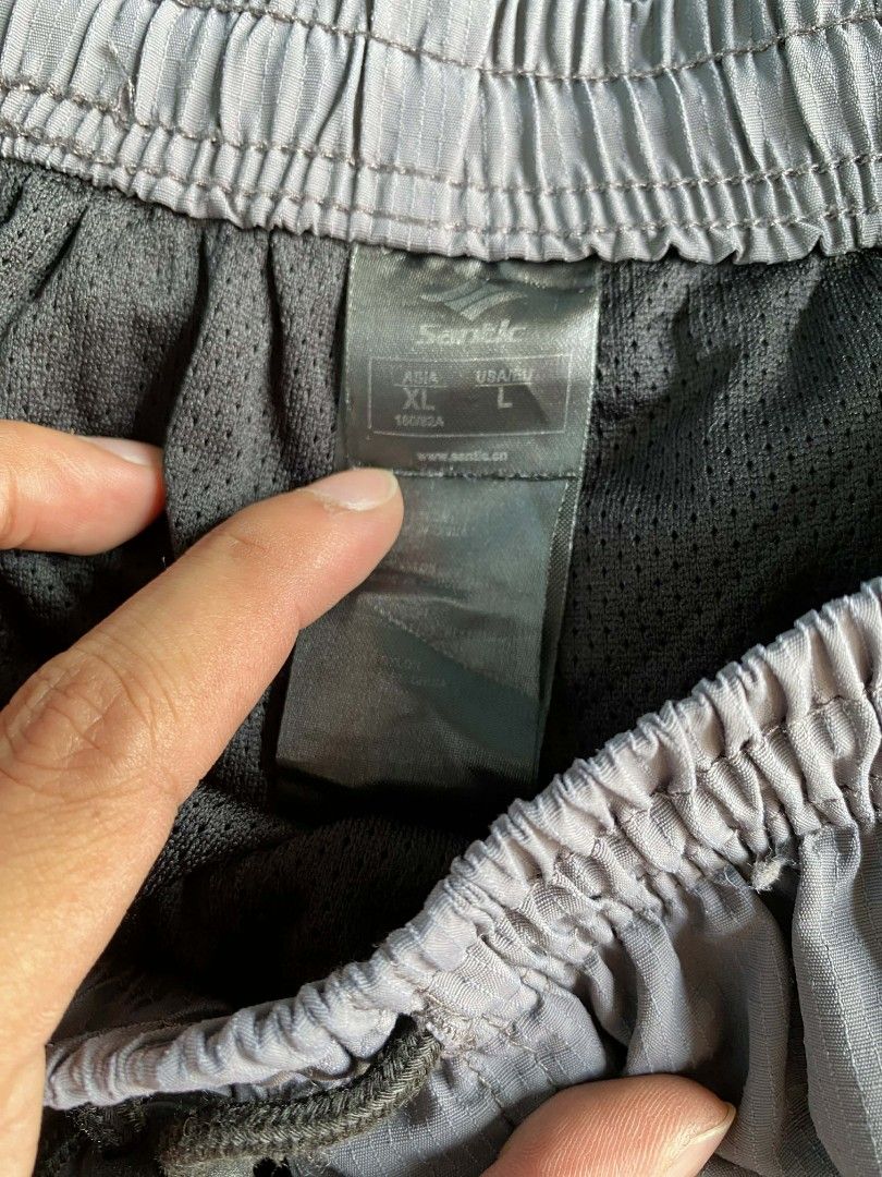 Santic Cycling Shorts - XL (Category: Activewear) located in Manila. Submitted by raymondrob54698 (Listing ID 1431737344, Image 3). Description: - Santic cycling shorts - Color: Gray with black accents - Size: XL - Features: - Zippered pockets - Elastic waistband with drawstring - Santic logo on leg - Ideal for cycling and outdoor activities with pad.