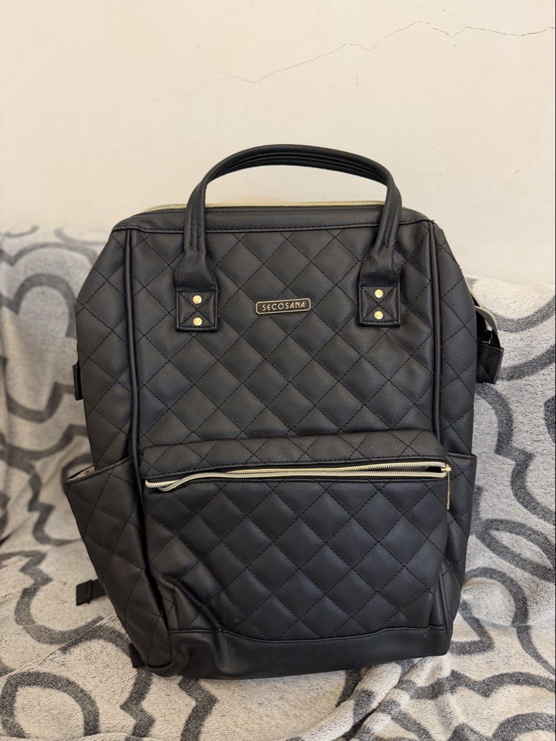 sept SALE Secosana Black Quilted Backpack (Category: Backpacks) located in Rizal. Submitted by woof.and.meow (Listing ID 1431751676, Image 1). Description: SALE USED ONCE with some white spots due to storage but all good like new - Secosana black backpack - Stylish quilted design - Top handle and adjustable straps - Multiple compartments for organization - Front zippered pocket - Side pockets - Interior pockets - Elegant gold-toned hardware - Per