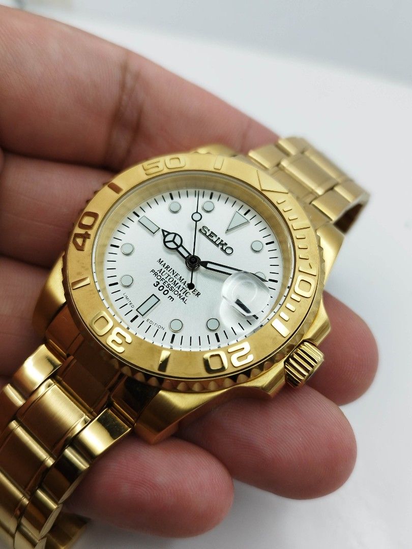 Seikolex sub gold watch (Category: Men's Watches) located in Quezon City. Submitted by WatchProject (Listing ID 1431751869, Image 2). Description: original 7s26 Seiko movement newly overhauled and oiled movement 904L stainless steel aftermarket base 305L stainless steel aftermarket strap aftermarket dial and hands 40mm case dm sapphire glass I'm good running condition with box paper bag.