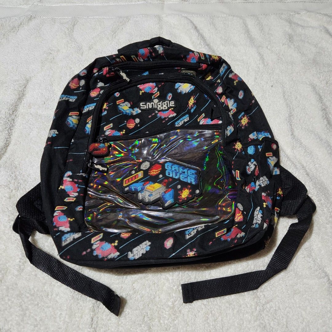Smiggle Black Backpack (Category: Babies & Kids Fashion) located in Taguig. Submitted by sarisaristorebyks (Listing ID 1431760302, Image 1). Description: Original Flaws: Stains sa ilalim ng bag.