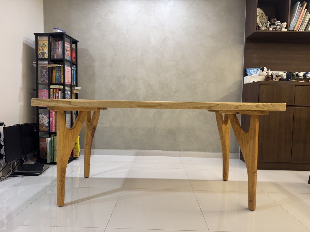 Solid Wood Dining Table (Category: Tables & Sets) located in Singapore. Submitted by randolf23 (Listing ID 1431573676, Image 1). Description: - Beautiful solid wood dining table - Unique leg design - Natural wood grain finish - Versatile use: dining or desk Specs: 5cm thick W85x L160xH75cm .