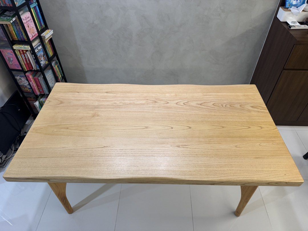 Solid Wood Dining Table (Category: Tables & Sets) located in Singapore. Submitted by randolf23 (Listing ID 1431573676, Image 2). Description: - Beautiful solid wood dining table - Unique leg design - Natural wood grain finish - Versatile use: dining or desk Specs: 5cm thick W85x L160xH75cm .