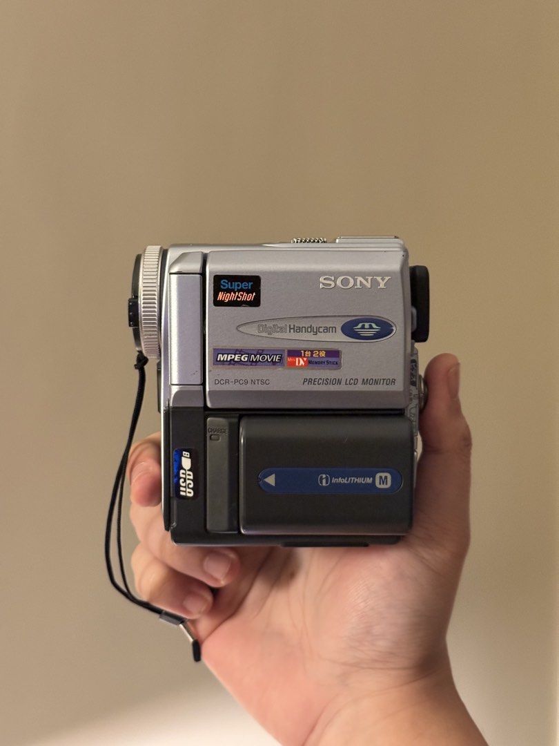Sony DCR-PC9 MiniDV Hanydcam/Camcorder (Category: Video Cameras) located in Manila. Submitted by christian_bagz (Listing ID 1431582888, Image 1). Description: Sony DCR-PC9 MiniDV Hanydcam/Camcorder Php 8999 (Negotiable) Cosmetics 10/10 (Clean unit) A handycam and a digicam at the same time. The Sony DCR-PC9 is a compact MiniDV camcorder released in the early 2000s. Known for its small size and advanced features for its time, it offered a blend of