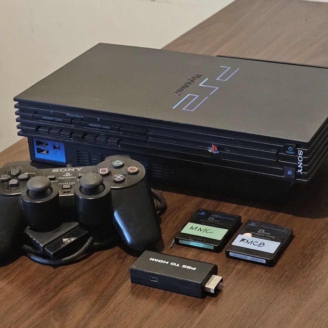Sony PlayStation 2 Console (modified, 110v) (Category: PlayStation) located in Mandaluyong City. Submitted by limerick18 (Listing ID 1431631490, Image 1). Description: Selling 2nd hand modified PS2 console. Sold as-is. Inclusions: - Black PlayStation 2 console with 160GB HDD (Note: disc tray not working) -- FastHDBoot modified - 1 controller - AV Cable - PS2 to HDMI adapter (only works on some TV) - Memory Card - Transformer (110v) Power supply C