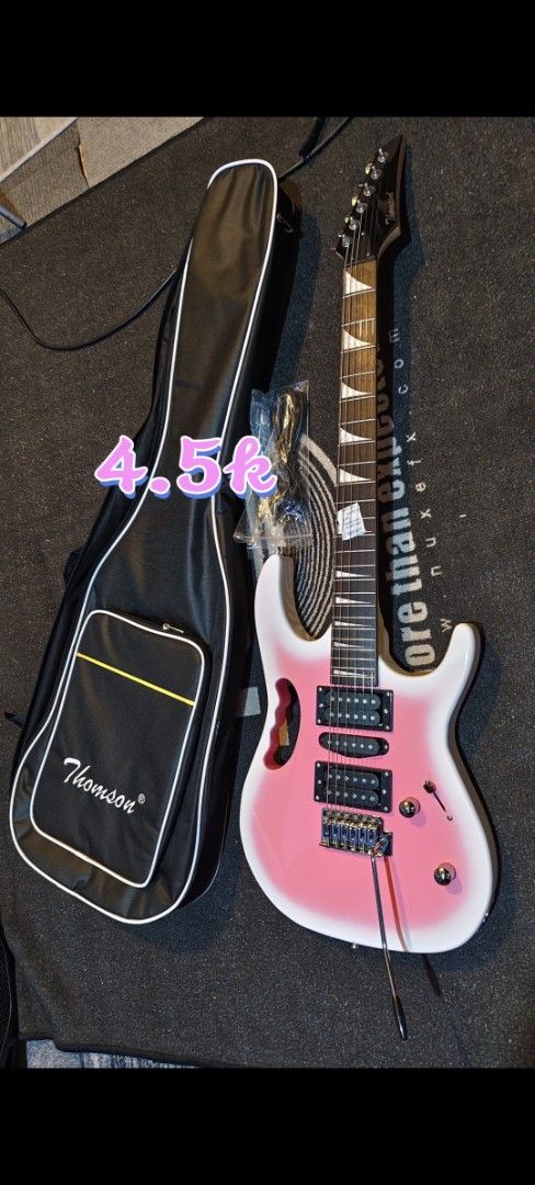 Thomson Electric Guitar with Case - Blue (Category: Musical Instruments) located in Pasig City. Submitted by tupriomichaeljohn (Listing ID 1431742208, Image 2). Description: nsa picture prices Electric guitar with a blue finish. Includes a black Thomson guitar case. The guitar has a classic Les Paul style body. The headstock has a logo. Comes with a case..