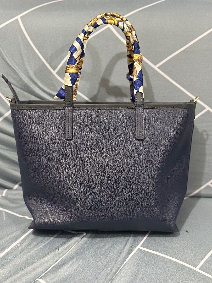 Tory Burch Cameron Mini Square Tote (Category: Luxury Bags & Wallets) located in Mandaluyong City. Submitted by pricecutbyku (Listing ID 1431762276, Image 3). Description: - Tory Burch tote bag in navy blue - Gold-tone logo - Detachable charm and scarf detail - Interior zippered pocket and compartments - Structured leather design - Includes original tag bought in US good condition free twilly issue: peeling sa strap and lips of bag but can be cov