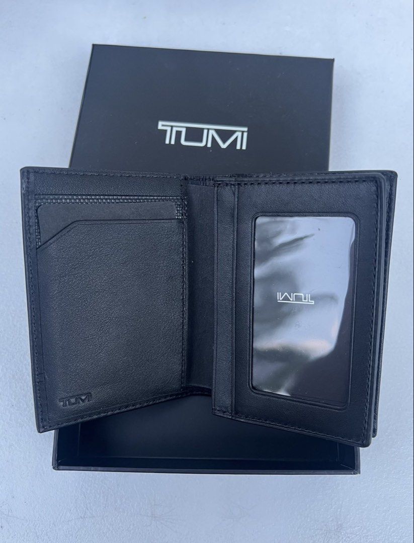 TUMI Leather Wallet / Card holder (Category: Wallets & Card Holders) located in Quezon City. Submitted by soohthings (Listing ID 1431576810, Image 2). Description: - TUMI leather wallet / card holder - Features multiple card slots - Includes a clear ID window - Comes with the original box - Classic black color - Original ; directly bought in Tumi store in US.