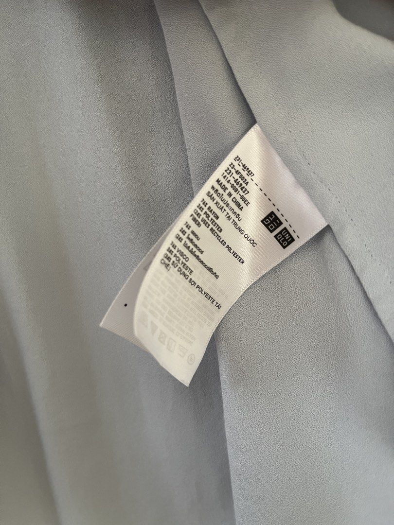 Uniqlo Long Sleeve Blouse (Category: Blouses) located in Quezon City. Submitted by findingthingzzz (Listing ID 1431614147, Image 2). Description: - Uniqlo light blue long sleeve blouse - Mandarin collar - Button-down front - Material: Rayon/Polyester blend - Long sleeves with gathered cuffs - Made in China.