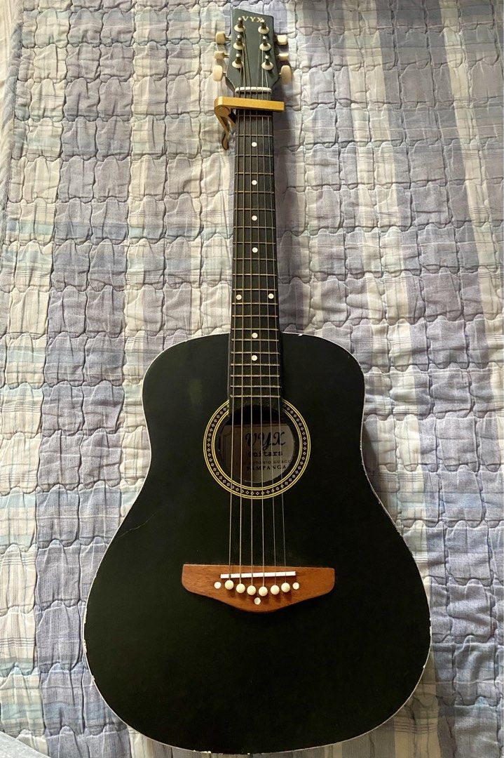 VYX Classic Black Acoustic Guitar (Category: Musical Instruments) located in Cainta. Submitted by sneakseller1995 (Listing ID 1431625051, Image 1). Description: Brand: VYX 34 Inches Good as new Low action Tuned Perfect for Beginners!.