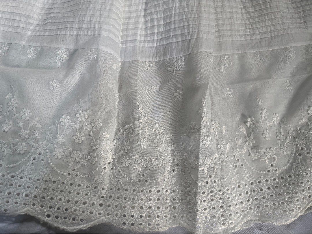 White Embroidered Maxi Skirt (Category: Skirts) located in Manila. Submitted by raphaelain17296 (Listing ID 1431732143, Image 1). Description: - White maxi skirt - Elastic waistband - Floral embroidery on hem - Tiered design - Flowy silhouette - Lightweight fabric - Casual and comfortable - Feminine aesthetic.