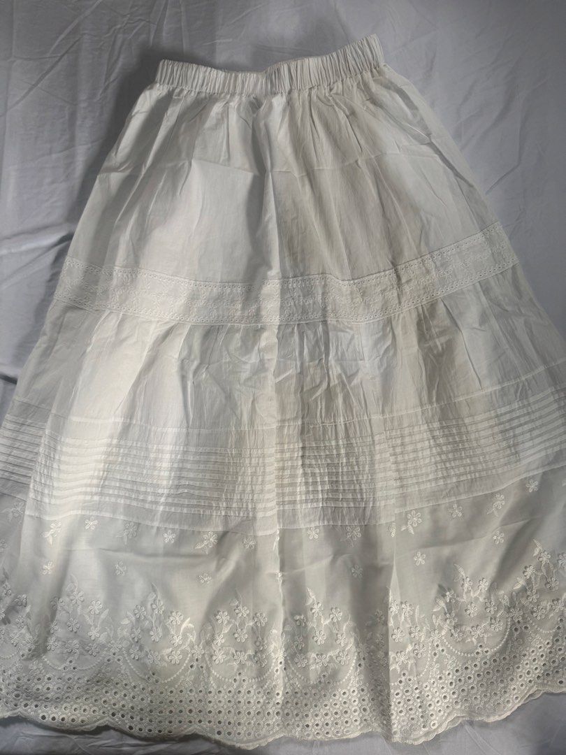 White Embroidered Maxi Skirt (Category: Skirts) located in Manila. Submitted by raphaelain17296 (Listing ID 1431732143, Image 3). Description: - White maxi skirt - Elastic waistband - Floral embroidery on hem - Tiered design - Flowy silhouette - Lightweight fabric - Casual and comfortable - Feminine aesthetic.