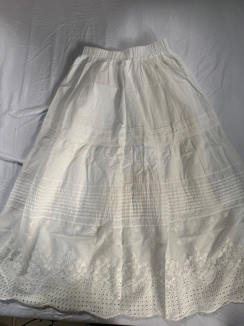 White Embroidered Maxi Skirt (Category: Skirts) located in Manila. Submitted by raphaelain17296 (Listing ID 1431732143, Image 2). Description: - White maxi skirt - Elastic waistband - Floral embroidery on hem - Tiered design - Flowy silhouette - Lightweight fabric - Casual and comfortable - Feminine aesthetic.