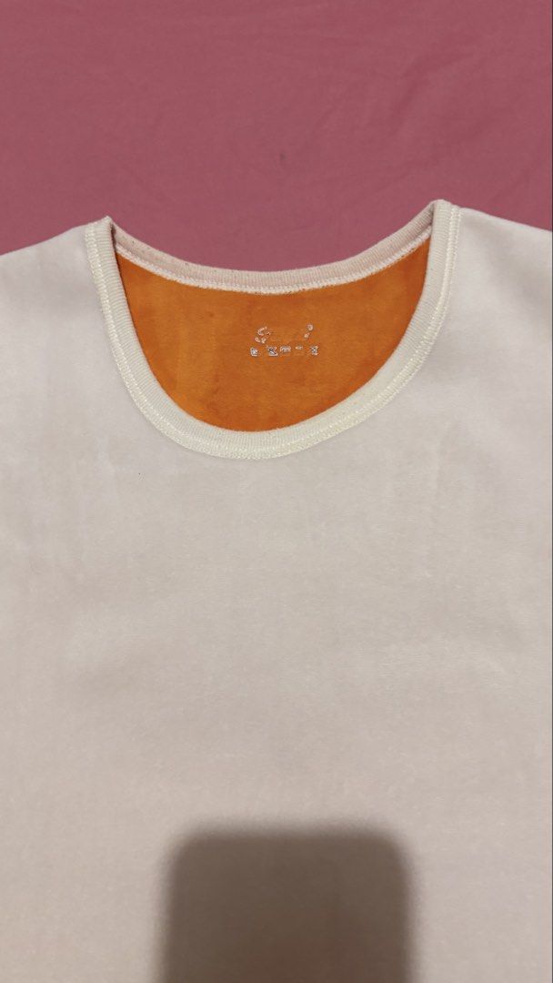 Women Tank Top (Category: Sleeveless) located in Marilao. Submitted by ac_declutters (Listing ID 1431725837, Image 3). Description: - Women tank top - White with orange lining - Round neckline - Sleeveless - Soft material - Stitched hem.