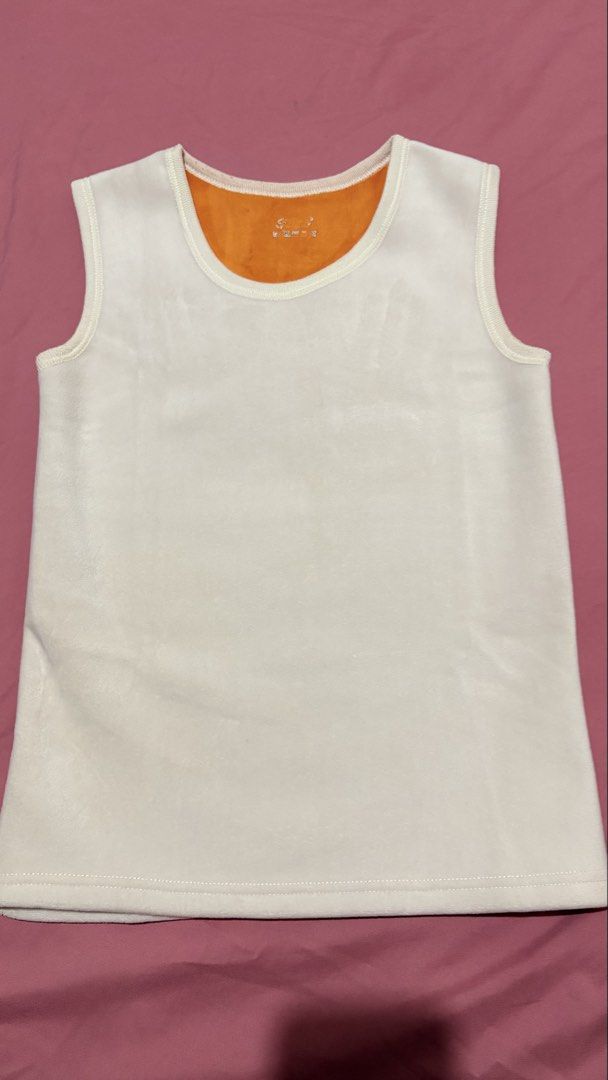 Women Tank Top (Category: Sleeveless) located in Marilao. Submitted by ac_declutters (Listing ID 1431725837, Image 2). Description: - Women tank top - White with orange lining - Round neckline - Sleeveless - Soft material - Stitched hem.