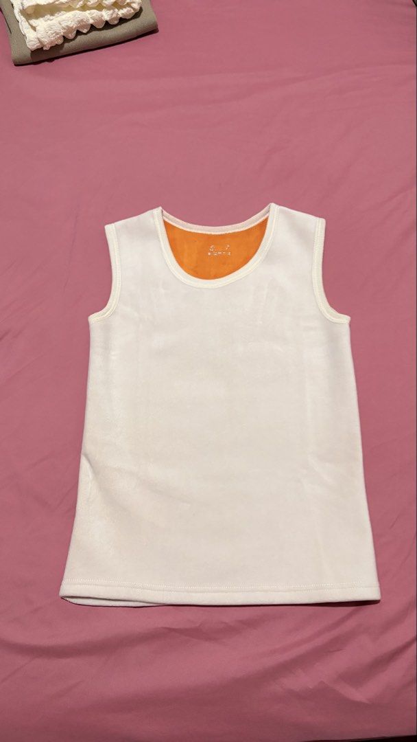 Women Tank Top (Category: Sleeveless) located in Marilao. Submitted by ac_declutters (Listing ID 1431725837, Image 1). Description: - Women tank top - White with orange lining - Round neckline - Sleeveless - Soft material - Stitched hem.