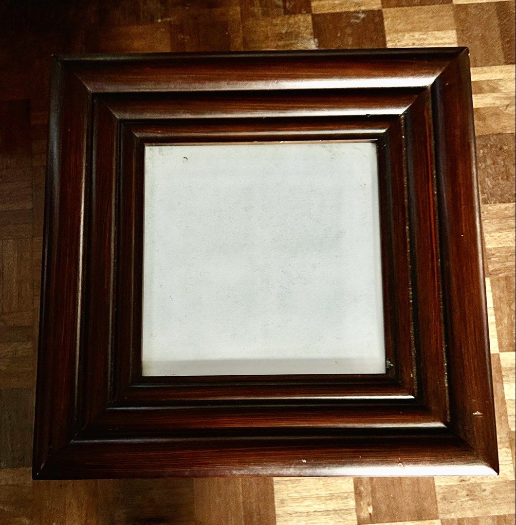 Wooden Photo Frame (Category: Frames & Pictures) located in Las Pinas. Submitted by rjmwings (Listing ID 1431592424, Image 3). Description: Square wooden photo frame with a dark brown finish. 14” x 14” It has a layered design around the opening. The back has metal clips to hold the photo in place and two hooks for hanging. The frame is ready to display your favorite photos..