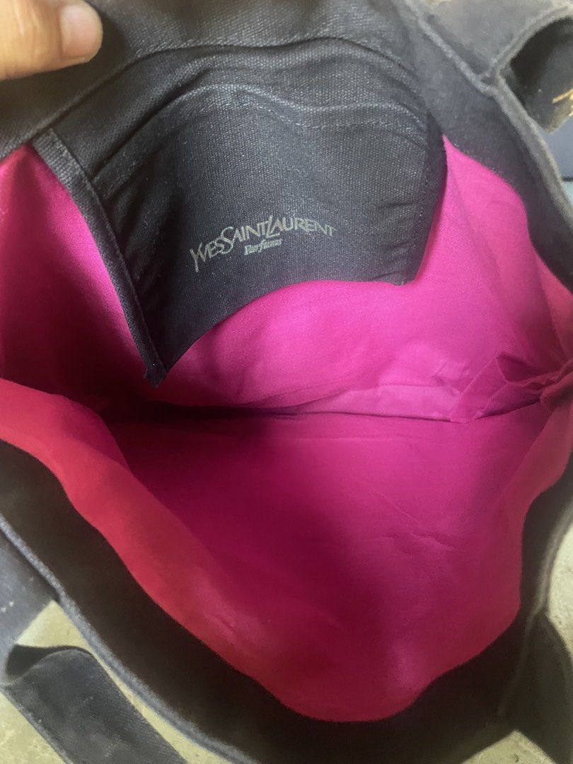 Yves Saint Laurent Black Tote Bag (Category: Beach Bags) located in Laguindingan. Submitted by kixseven (Listing ID 1431583233, Image 3). Description: - Yves Saint Laurent black tote bag - Gold logo on front and straps - Bright pink interior lining - Interior pocket with Yves Saint Laurent Parfums logo - Stylish and suitable for daily use - NO COD ❌ - Location : Mindanao - Ship nationwide - MOP : gcash - With signs of use ( 2nd hand item ) - Colo