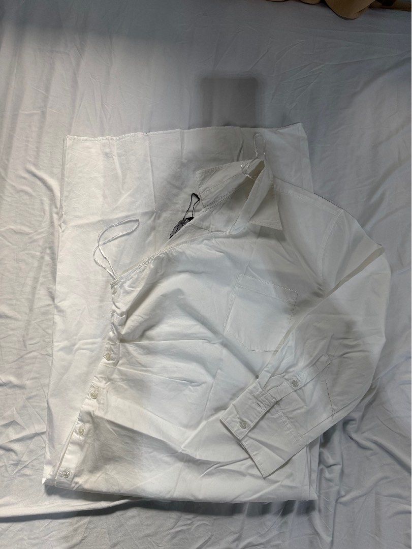 Zara White Shirt - Size M (Category: Shirts) located in Manila. Submitted by raphaelain17296 (Listing ID 1431734714, Image 2). Description: - Zara white shirt - Button-down style - Long sleeves - Features drawstring detail - Size: M - Made in Morocco.