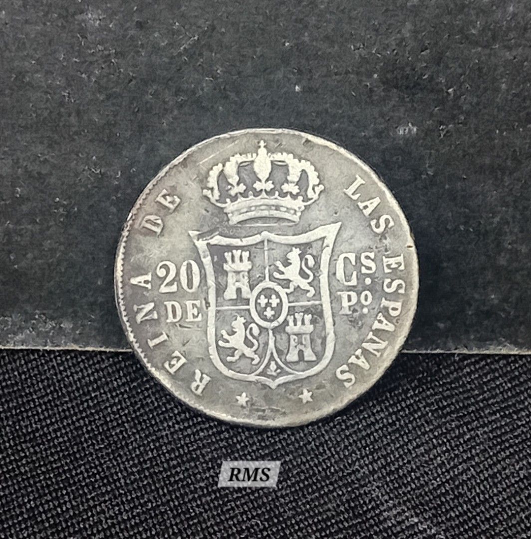 1867 Philippine 20C silver coin, Queen Isabel (Category: Currency) located in Quezon City. Submitted by coinsandbanknotes (Listing ID 1431904540, Image 2). Description: This is a 20 Centavos (or 20 Centimos de Peso) silver coin from the Philippines issued during the Spanish colonial period under Queen Isabella II. Coin Specifications & Identification Issuer: Philippines (Spanish Colony) Monarch: Isabella II (reigned 1833–1868) Value: 20 Centavos 