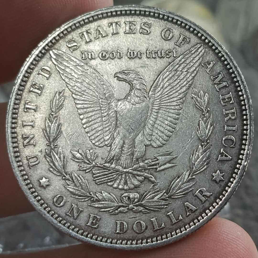 1879 Morgan Silver Dollar Coin (Category: Currency) located in Quezon City. Submitted by Coiners (Listing ID 1431994519, Image 2). Description: - 1879 Morgan Silver Dollar - Features Lady Liberty on the obverse - Reverse side shows an eagle and "ONE DOLLAR" - Silver color.