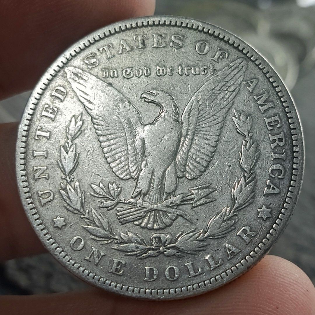1883 Morgan Silver Dollar Coin (Category: Currency) located in Quezon City. Submitted by Coiners (Listing ID 1431994264, Image 2). Description: - 1883 Silver Dollar Coin - Obverse: Lady Liberty, "E PLURIBUS UNUM", and 1883 date - Reverse: Eagle, "UNITED STATES OF AMERICA", and "ONE DOLLAR" - A classic US collectible coin..