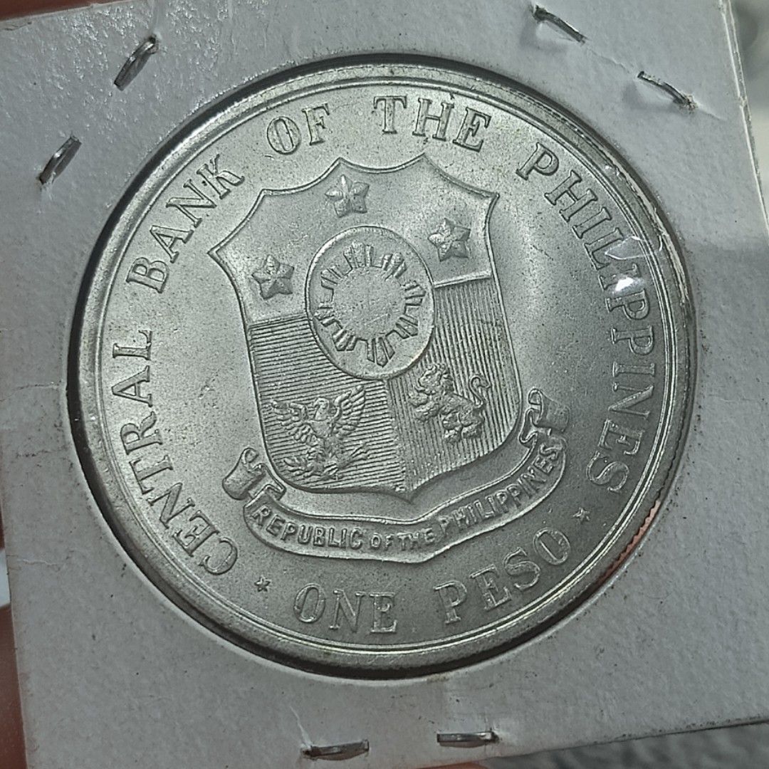 1963 Andres Bonifacio Centenary One Peso Coin (Category: Currency) located in Quezon City. Submitted by Coiners (Listing ID 1431994077, Image 2). Description: - 1963 One Peso coin - Commemorates Andres Bonifacio's centenary - Features Andres Bonifacio on the front - Central Bank of the Philippines seal on the back - Comes with a protective holder - Ideal for coin collectors.