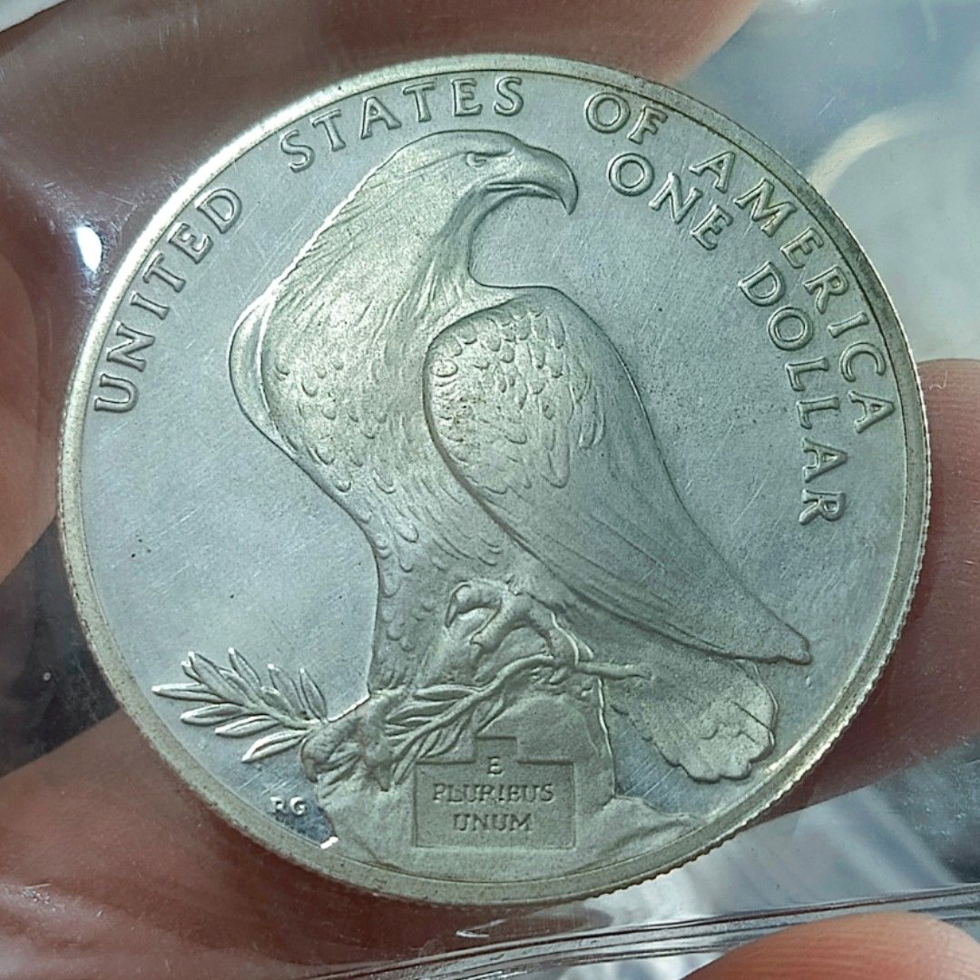 1984 Los Angeles Olympic Silver Dollar (Category: Currency) located in Quezon City. Submitted by Coiners (Listing ID 1431993895, Image 1). Description: - 1984 Los Angeles Olympics Silver Dollar Coin - Features an eagle design - Depicts the Olympic stadium - Inscriptions: 'United States of America', 'One Dollar', and 'Los Angeles XXIII Olympiad 1984'.