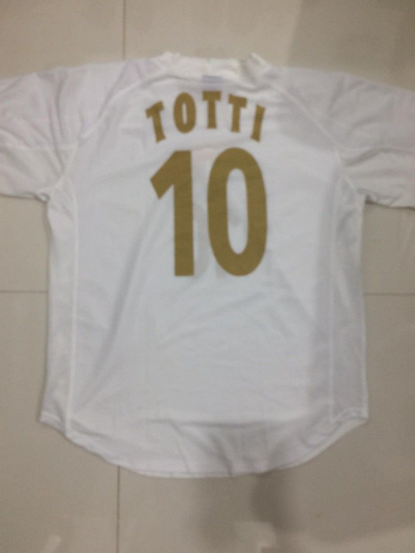 2000s Italy Totti Baggy Jersey (Category: Activewear) located in Davao. Submitted by bulletproofssoul (Listing ID 1431928892, Image 3). Description: sf should be covered by buyer message for more details already washed and cleaned price is negotiable MEASURMENTS: Pit to pit: 24" Length: 30" Shoulder to shoulder: 17" Sleeve: 15".