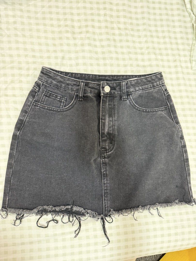 Acid wash black denim skirt (Category: Skirts) located in Bulacan. Submitted by tidycorner (Listing ID 1431825549, Image 1). Description: - acid black denim mini skirt - Frayed hem - Button closure - Pockets -27-28 waist .