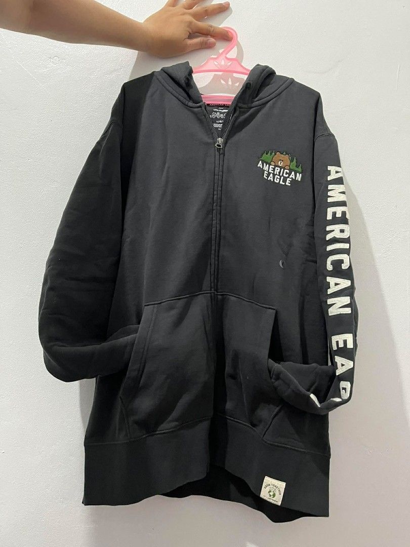 American Eagle Line Friends Hoodie (Category: Coats, Jackets and Outerwear) located in Taguig. Submitted by rtk06 (Listing ID 1431958968, Image 3). Description: - American Eagle hoodie with Line Friends design - Black color - Zip-up front - Hooded - Kangaroo pocket - American Eagle logo on sleeves - Bear graphic on chest - Original price: PHP 2,599.00.